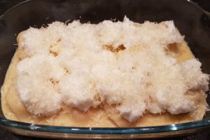 mit Parmesan bestreuen
